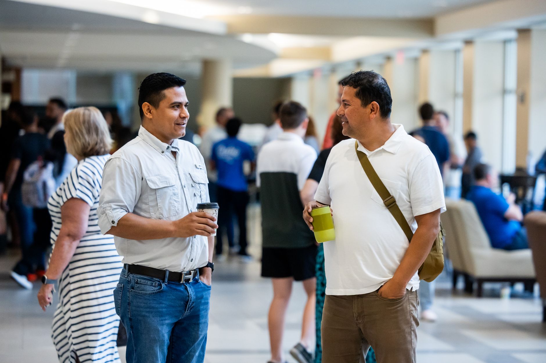 People talking at a community networking event